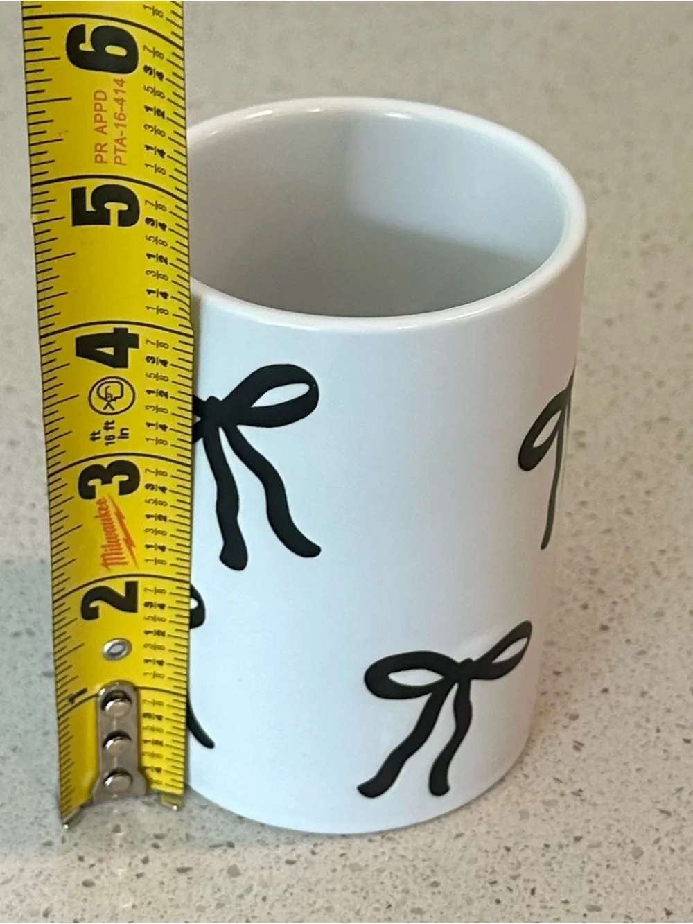 Rachel Zoe White Ceramic Tumbler with Black Bow Motif